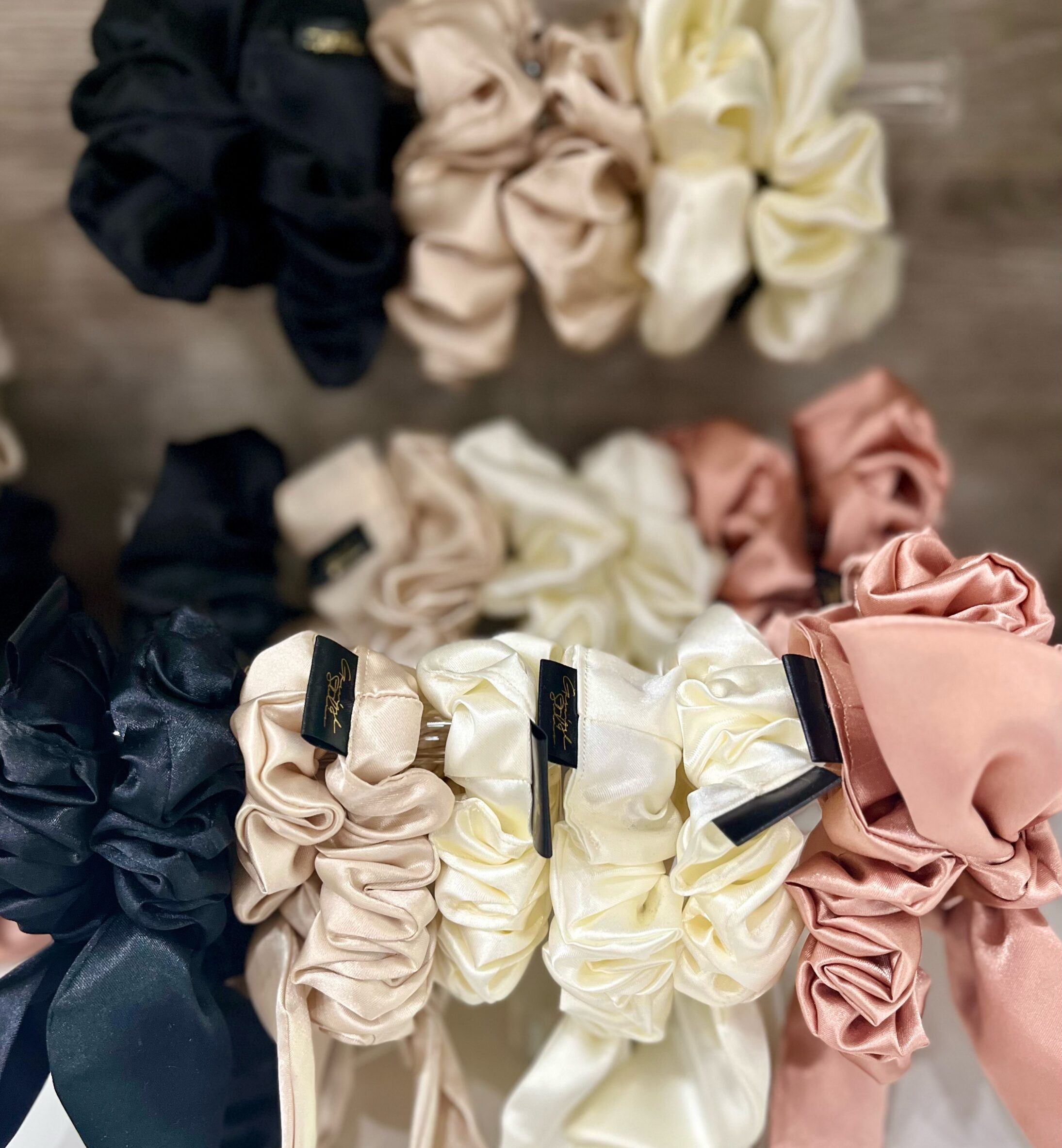 silk scrunchies, safe for extensions, on display for sale at Garnish