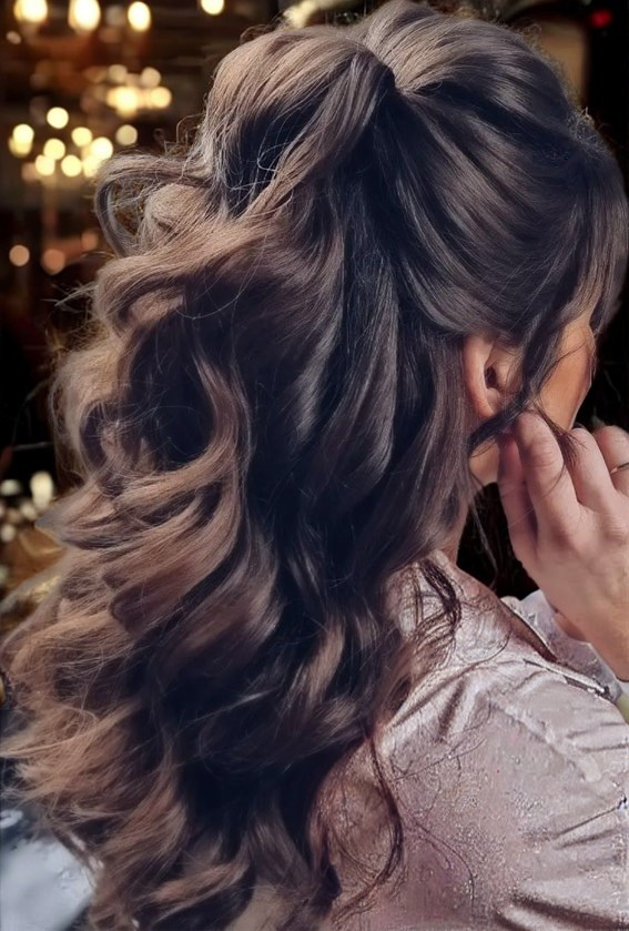 extension-safe holiday hair in a half-up teased pony