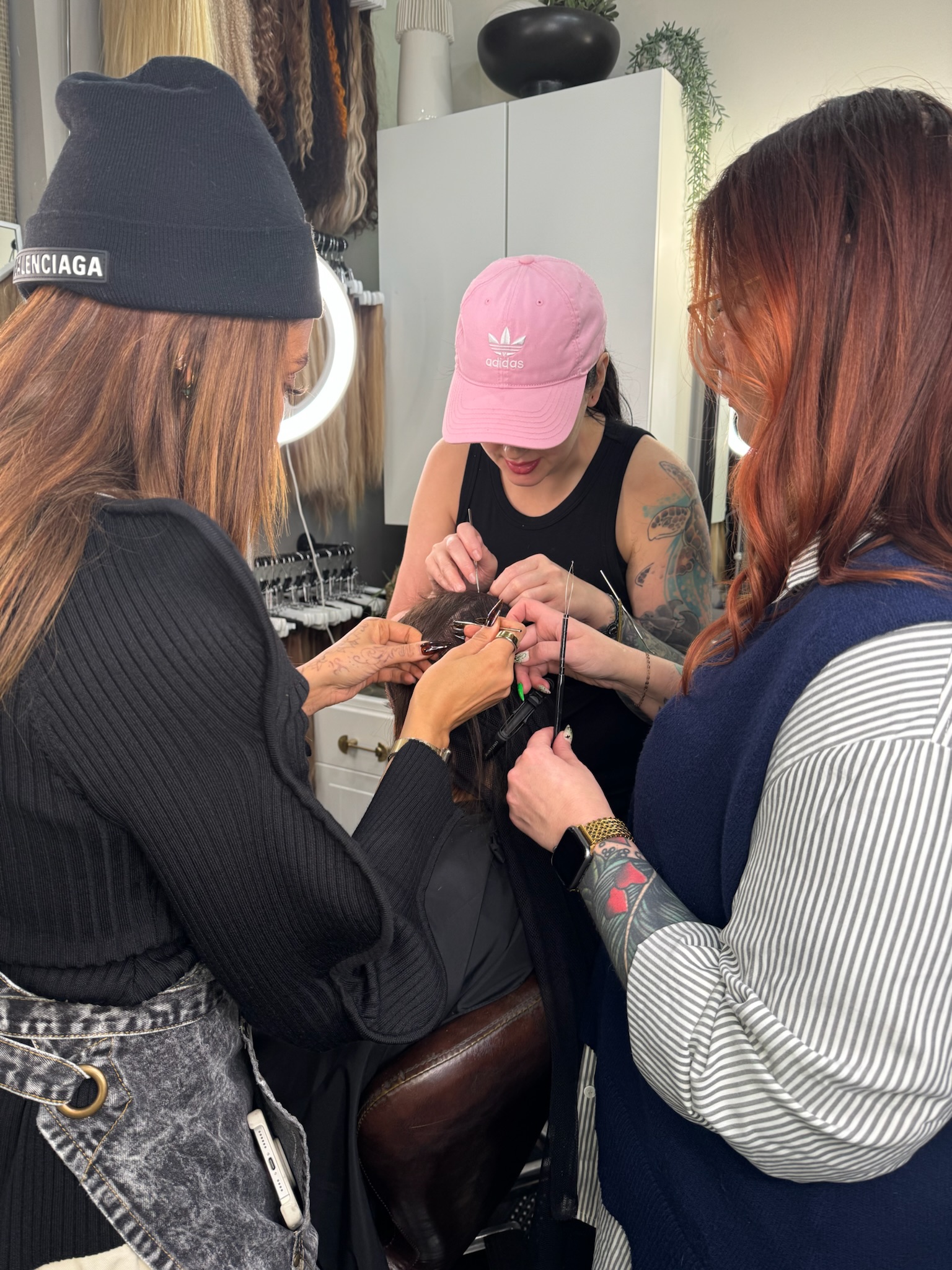 Garnish Collective stylists collaborate on a client's crown install