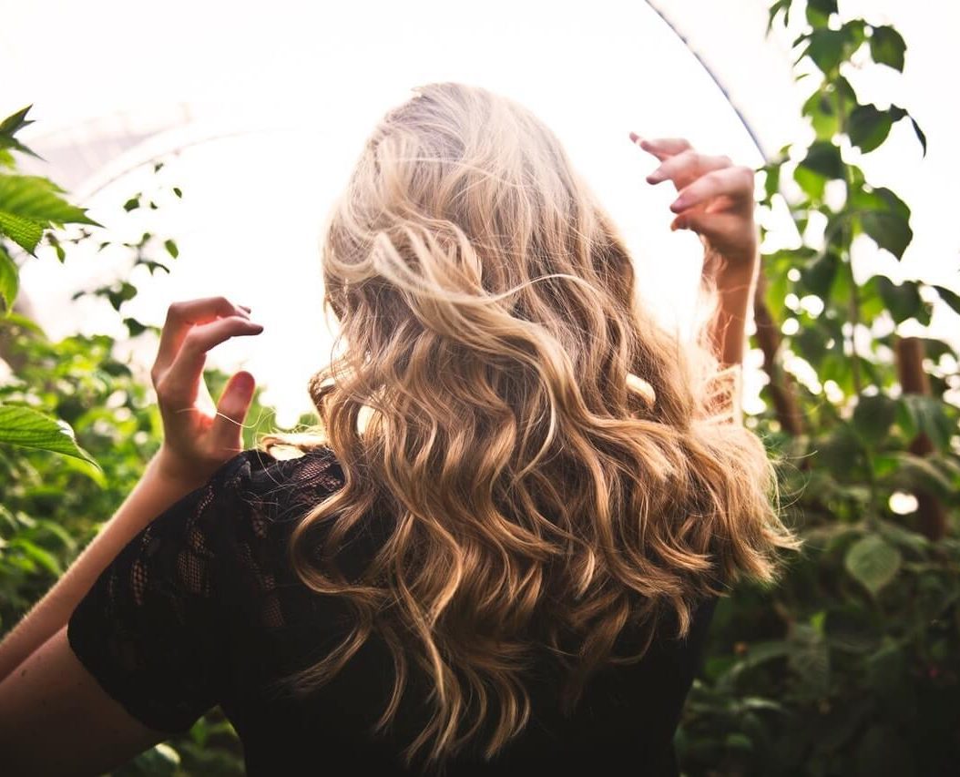 blonde woman enjoying spring extensions for hair loss solution