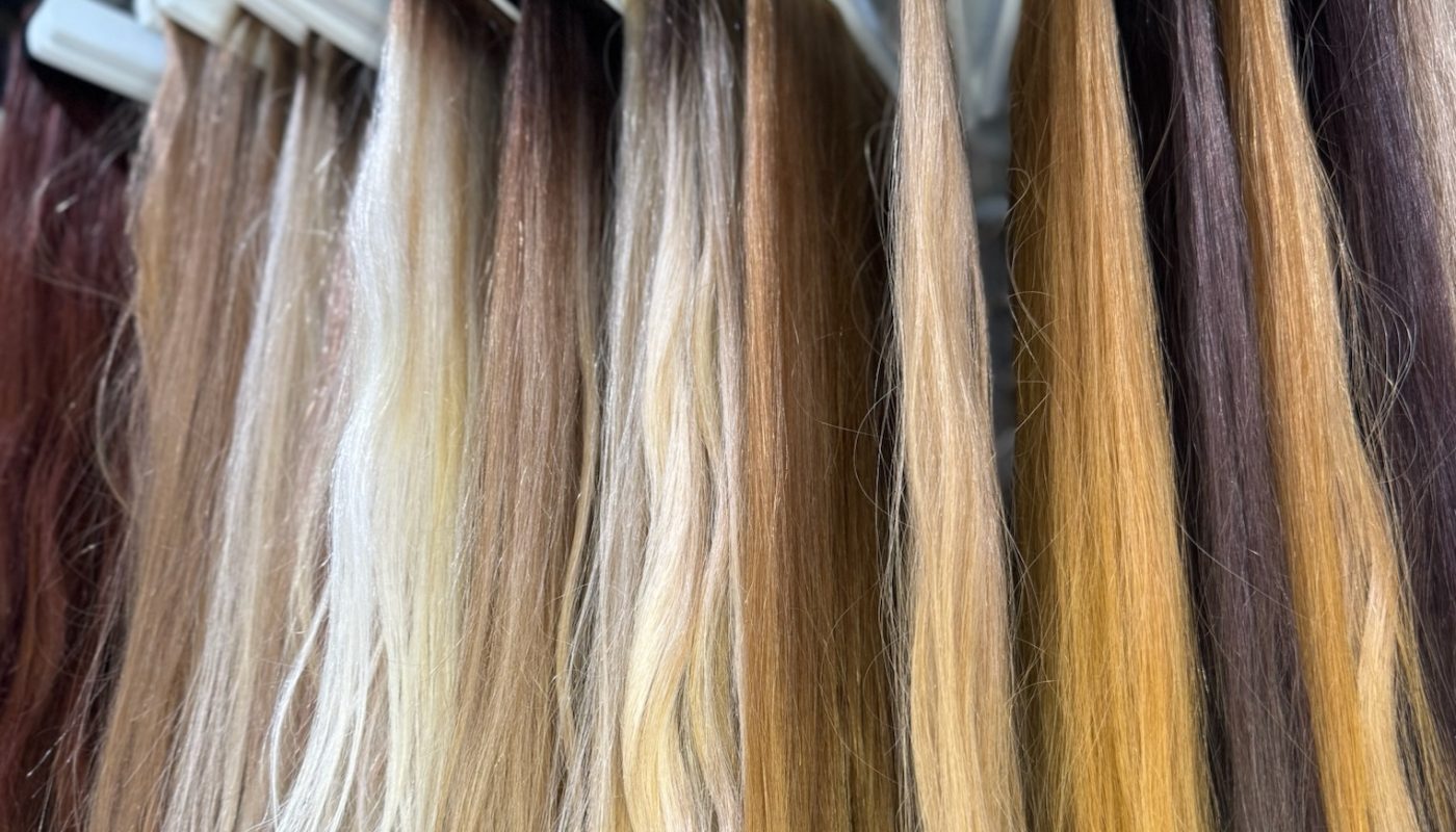 a row of wefts hanging in the back room of the Garnish Collective